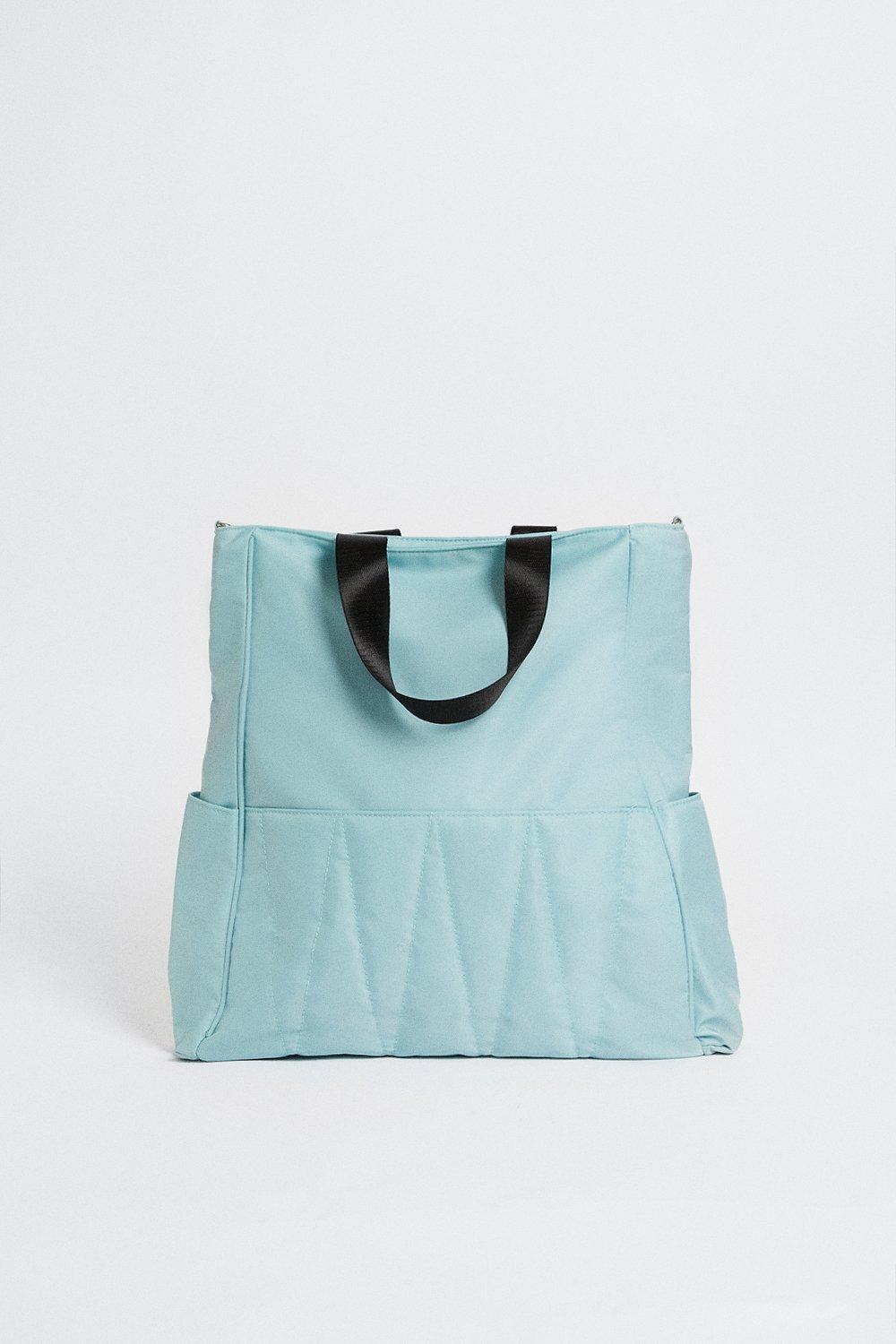 light blue quilted bag